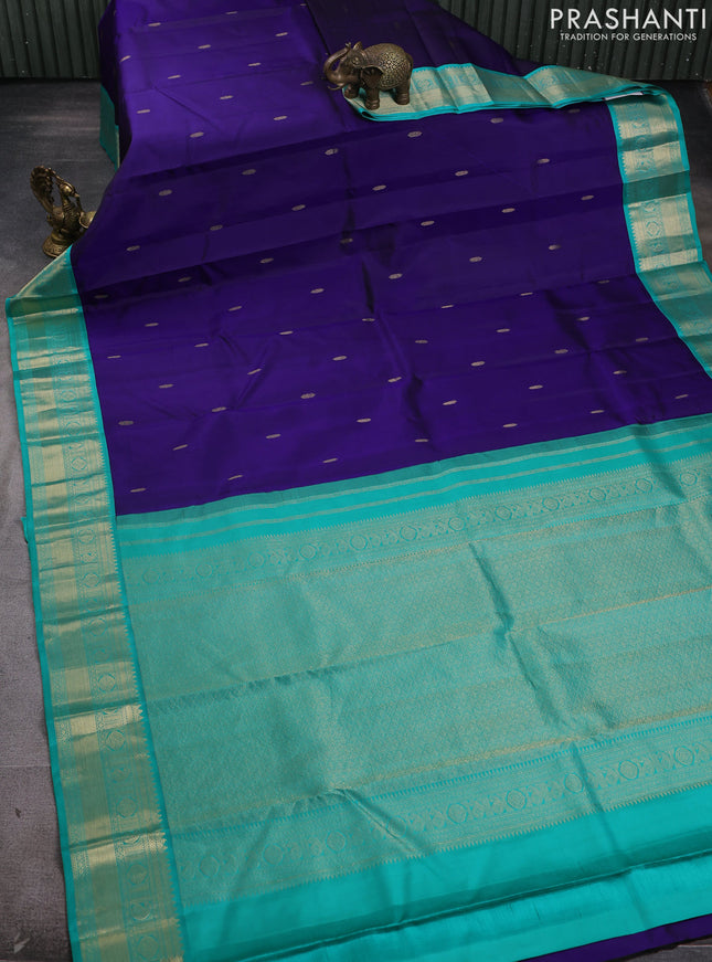 Pure kanchipram silk saree navy blue and teal green with zari woven buttas and zari woven korvai border