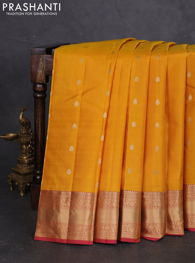 Pure kanchipram silk saree yellow and maroon with zari woven buttas and zari woven korvai border