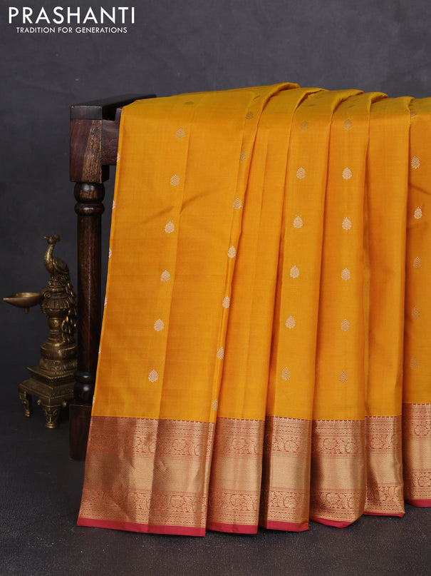 Pure kanchipram silk saree yellow and maroon with zari woven buttas and zari woven korvai border