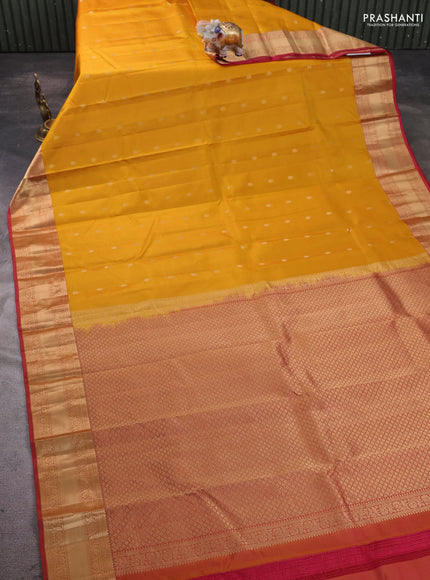 Pure kanchipram silk saree yellow and maroon with zari woven buttas and zari woven korvai border