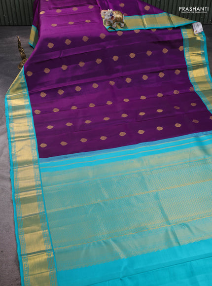 Pure kanchipram silk saree purple and teal blue with zari woven buttas and zari woven korvai border