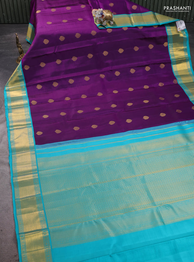 Pure kanchipram silk saree purple and teal blue with zari woven buttas and zari woven korvai border