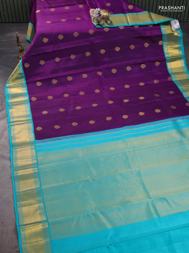 Pure kanchipram silk saree purple and teal blue with zari woven buttas and zari woven korvai border