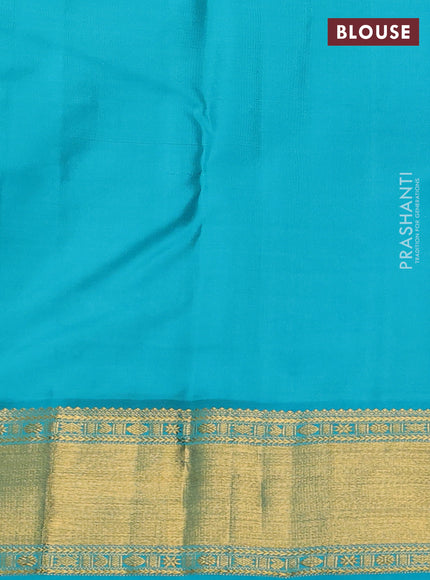 Pure kanchipram silk saree dual shade of pinkish orange and teal blue with zari woven buttas and zari woven korvai border