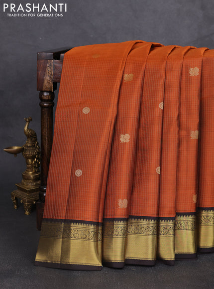 Pure kanchipram silk saree rust shade and coffee brown with allover zari small checks & buttas and zari woven korvai border