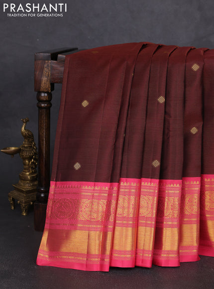 Pure kanchipram silk saree wine shade and peach pink with allover zari weaves & buttas and long zari woven korvai border