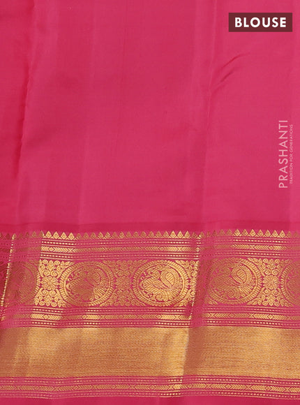 Pure kanchipram silk saree wine shade and peach pink with allover zari weaves & buttas and long zari woven korvai border