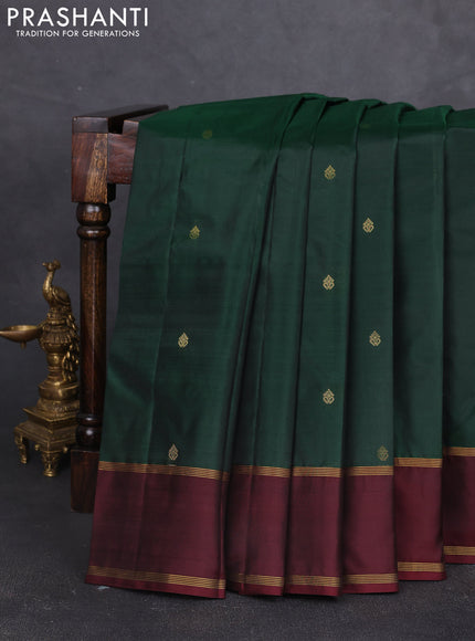 Pure kanchipram silk saree bottle green and deep maroon with zari woven buttas and rettapet zari woven border
