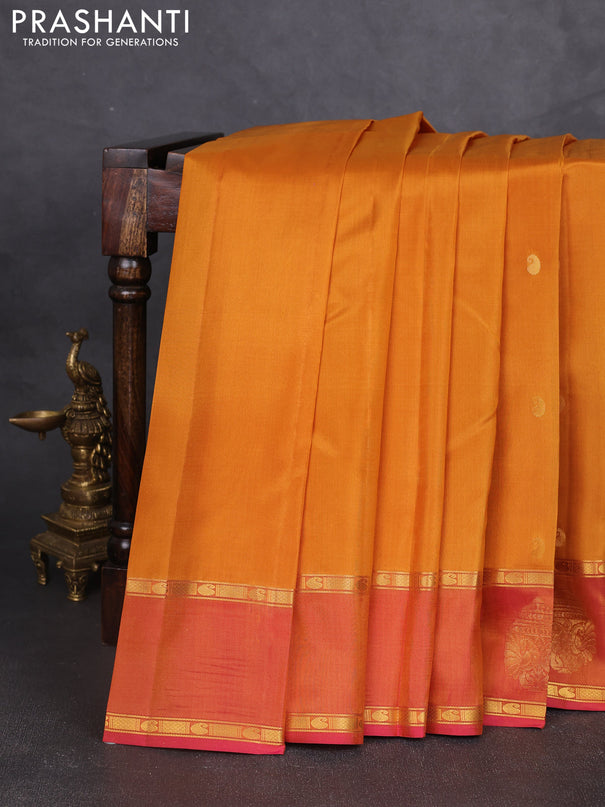 Pure kanchipram silk saree dark mustard and dual shade of pink with paisley zari woven buttas and zari woven butta border