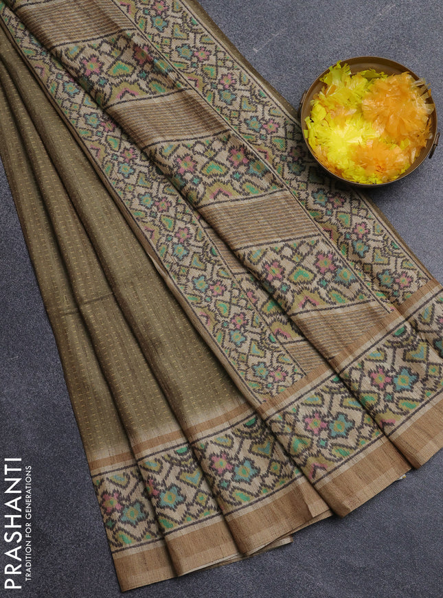 Art tussar saree mehendi green and beige with allover prints and patola printed border