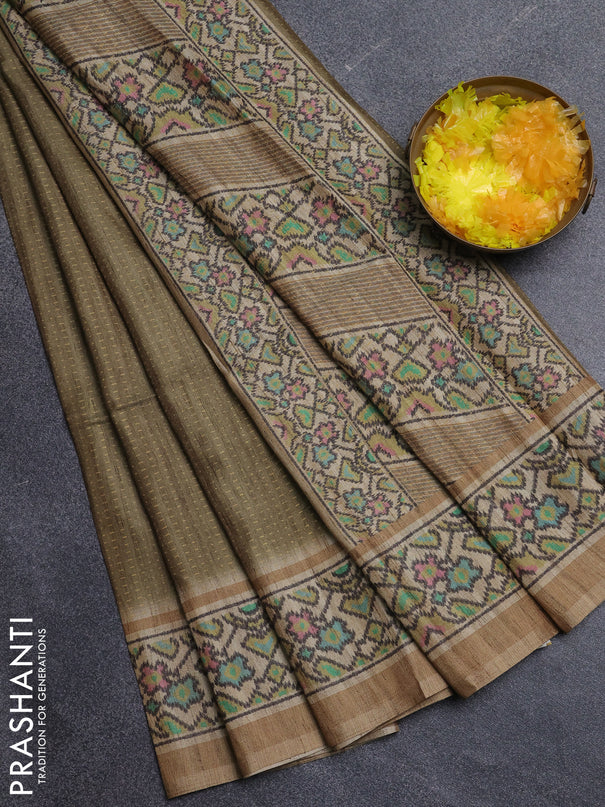 Art tussar saree mehendi green and beige with allover prints and patola printed border