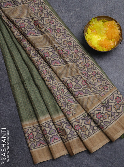 Art tussar saree green and beige with allover prints and patola printed border