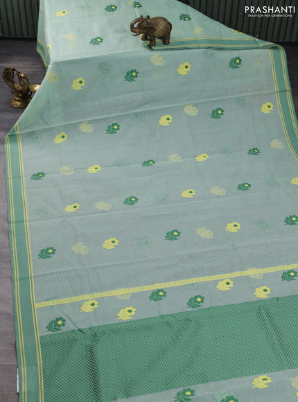 Handloom kota saree pastel green and green with floral thread woven buttas and rettapet border