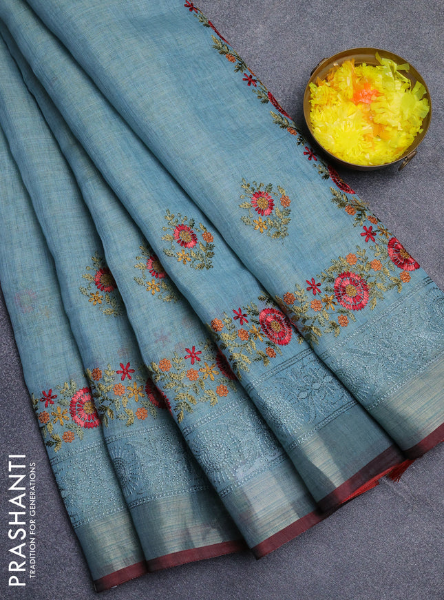 Linen cotton saree pastel blue and maroon with embroidery buttas and embroidery zari border