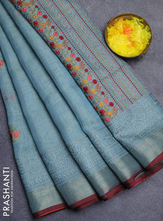 Linen cotton saree pastel blue and maroon with embroidery buttas and embroidery zari border