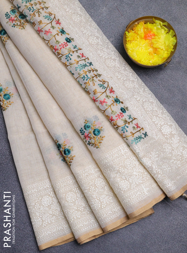 Linen cotton saree cream and teal green with embroidery buttas and embroidery zari border