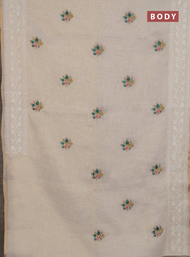 Linen cotton saree cream and teal green with embroidery buttas and embroidery zari border