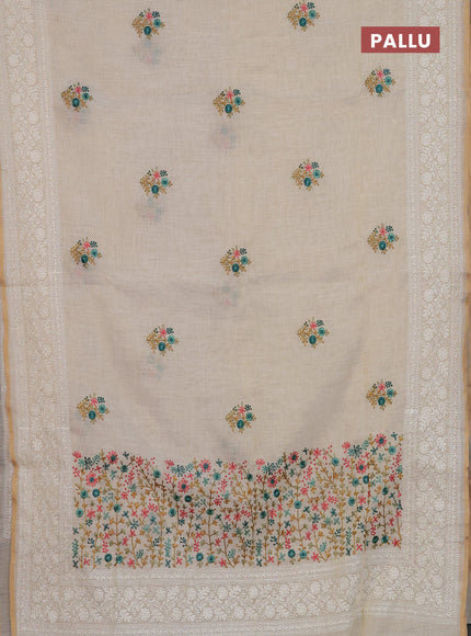 Linen cotton saree cream and teal green with embroidery buttas and embroidery zari border