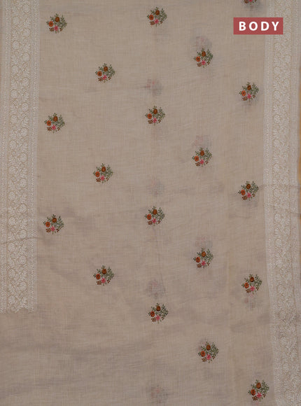 Linen cotton saree cream and rust shade with embroidery buttas and embroidery zari border