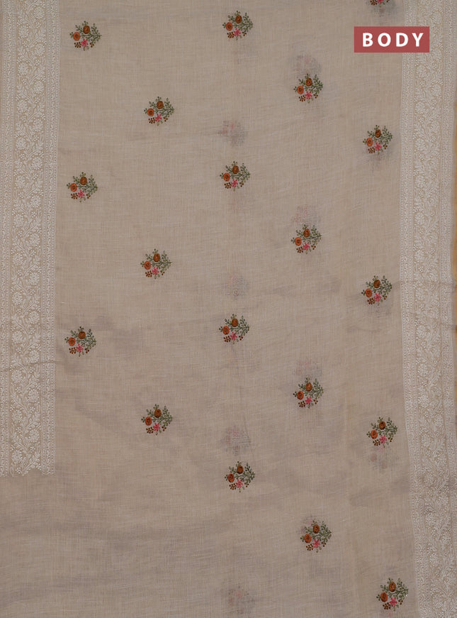 Linen cotton saree cream and rust shade with embroidery buttas and embroidery zari border
