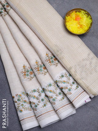Linen cotton saree cream and teal green with embroidery buttas and embroidery simple border