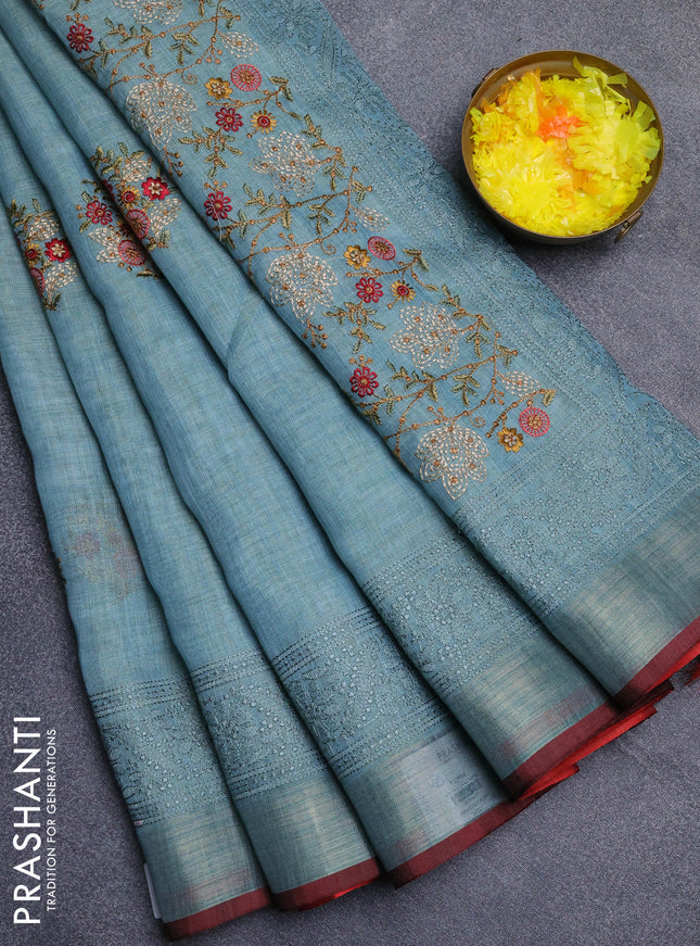 Linen cotton saree pastel blue and maroon with embroidery buttas and embroidery zari border