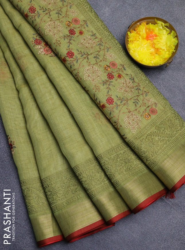 Linen cotton saree light green and maroon with embroidery buttas and embroidery zari border
