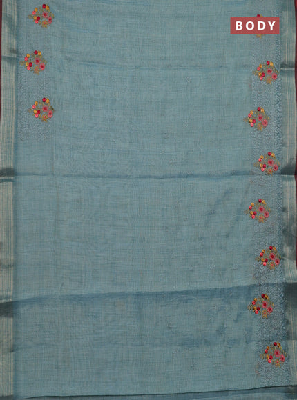 Linen cotton saree pastel blue and maroon with allover embroidery work and zari woven border