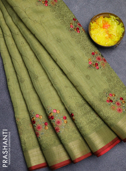 Linen cotton saree light green and red with allover embroidery work and zari woven border