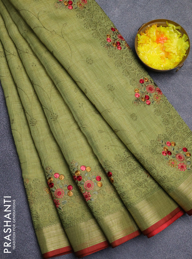 Linen cotton saree light green and red with allover embroidery work and zari woven border