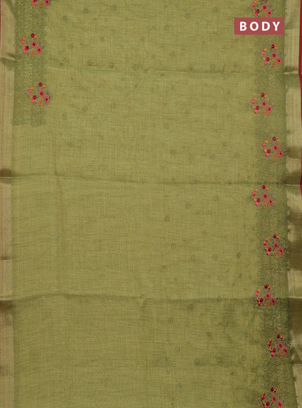 Linen cotton saree light green and red with allover embroidery work and zari woven border