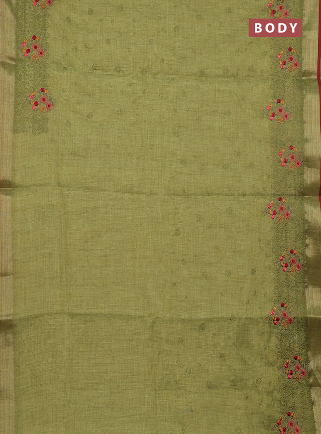 Linen cotton saree light green and red with allover embroidery work and zari woven border