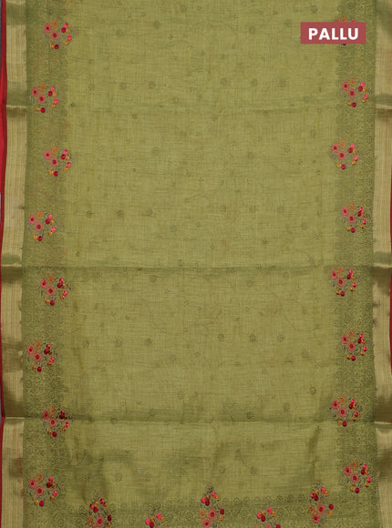 Linen cotton saree light green and red with allover embroidery work and zari woven border