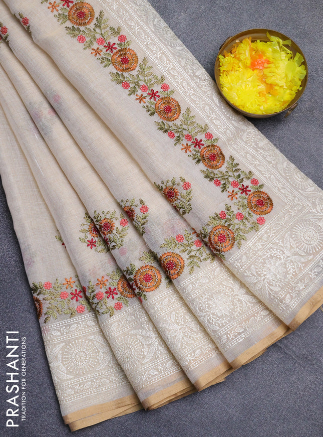 Linen cotton saree cream and maroon with embroidery buttas and embroidery work zari border