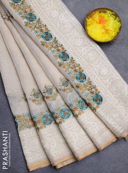 Linen cotton saree cream and teal blue with embroidery buttas and embroidery work zari border
