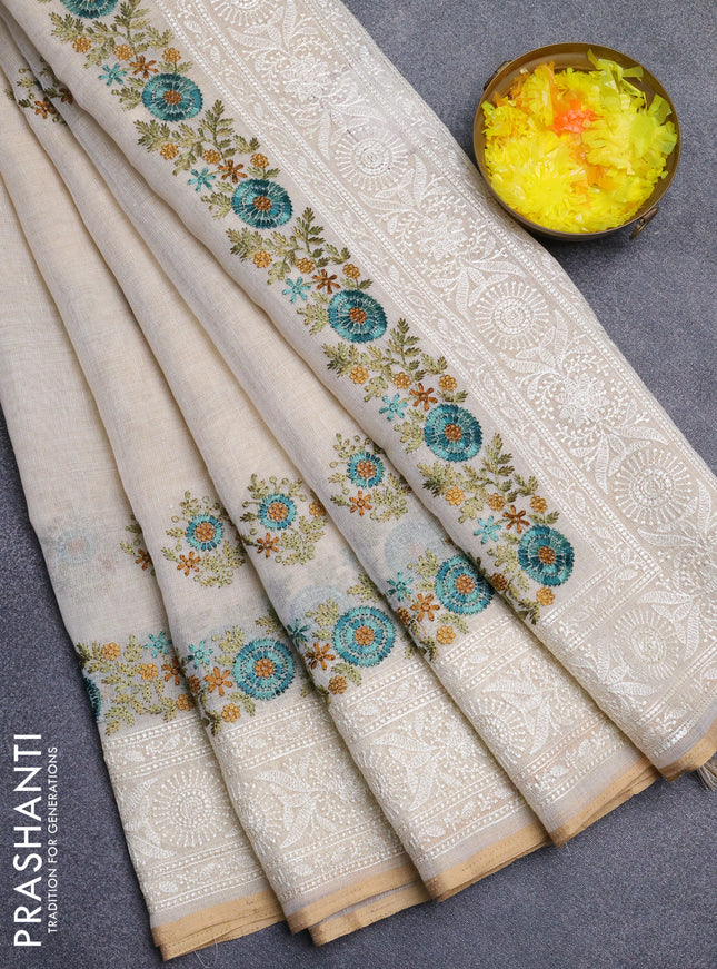 Linen cotton saree cream and teal blue with embroidery buttas and embroidery work zari border