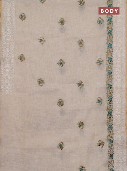 Linen cotton saree cream and teal blue with embroidery buttas and embroidery work zari border