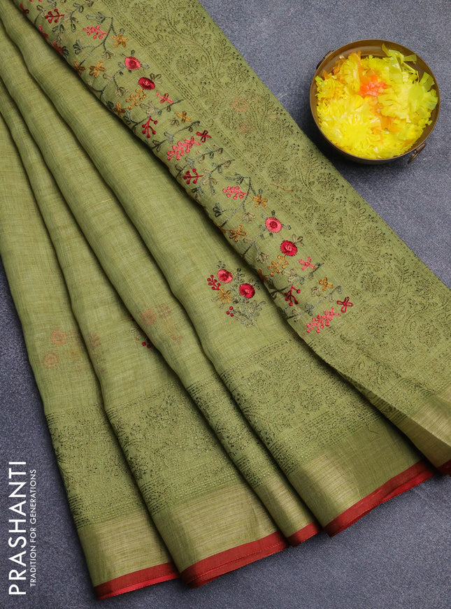 Linen cotton saree light green and maroon with embroidery buttas and embroidery work zari border
