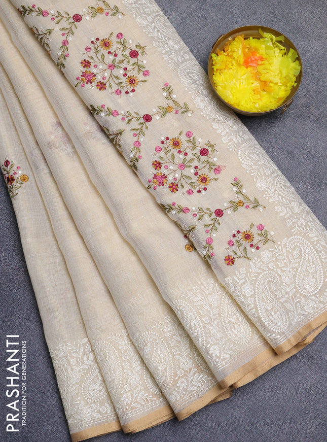 Linen cotton saree cream and pink with embroidery buttas and embroidery border