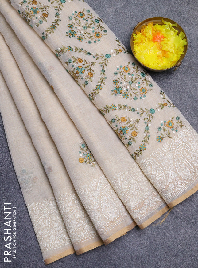 Linen cotton saree cream and teal green with embroidery buttas and embroidery border