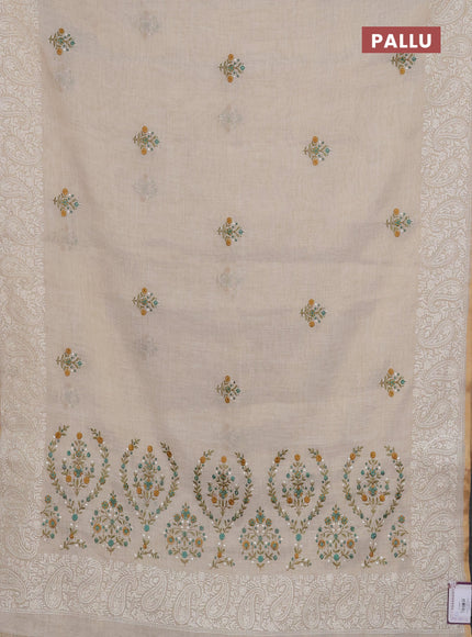 Linen cotton saree cream and teal green with embroidery buttas and embroidery border