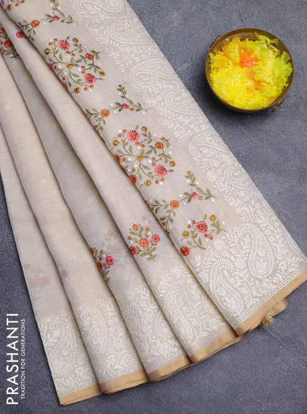 Linen cotton saree cream and peach shade with embroidery buttas and embroidery border