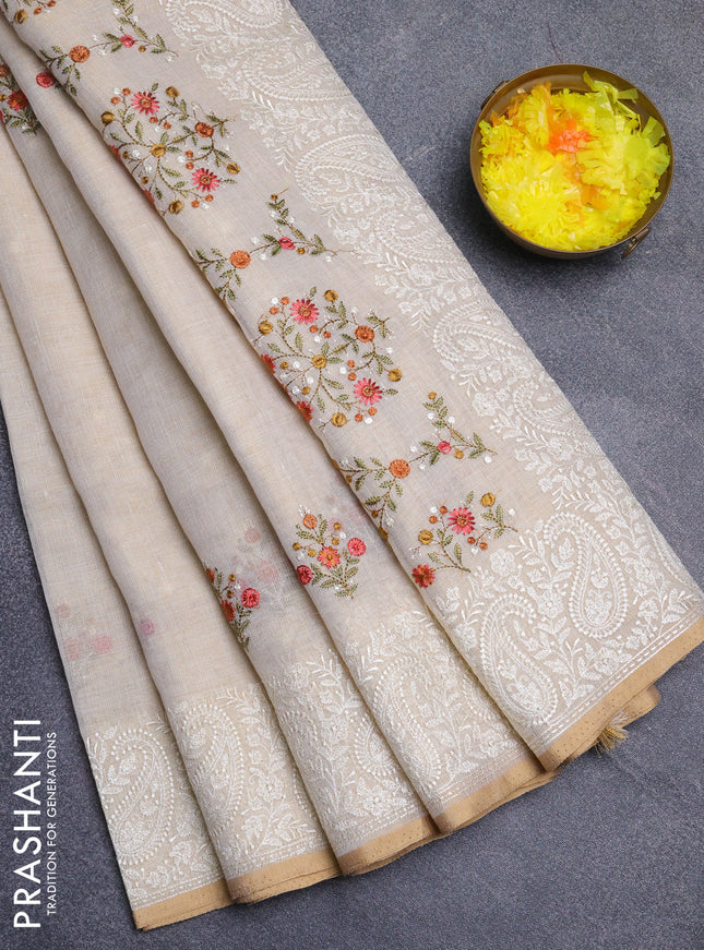 Linen cotton saree cream and peach shade with embroidery buttas and embroidery border