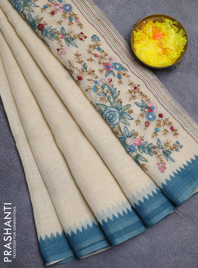 Linen cotton saree cream and blue with embroidery buttas and temple design simple border