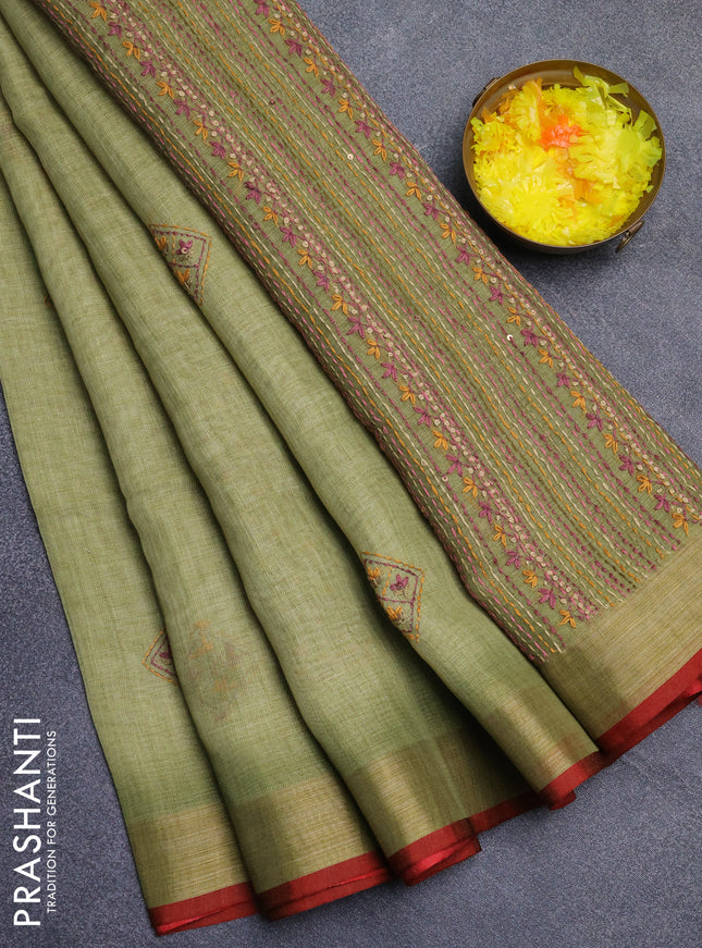 Linen cotton saree light green with embroidery buttas and zari woven border