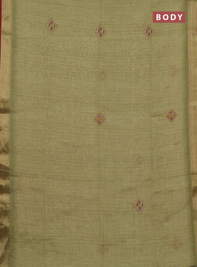 Linen cotton saree light green with embroidery buttas and zari woven border