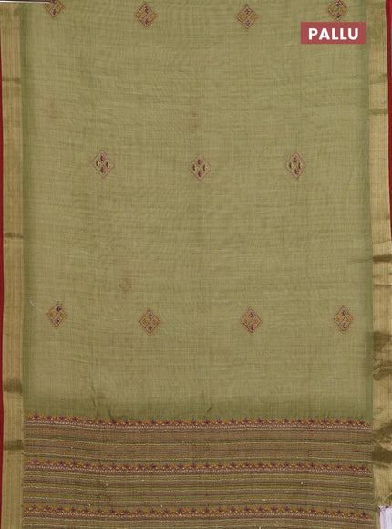 Linen cotton saree light green with embroidery buttas and zari woven border