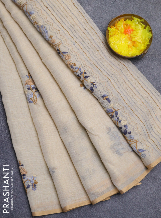 Linen cotton saree beige with embroidery buttas and zari woven border