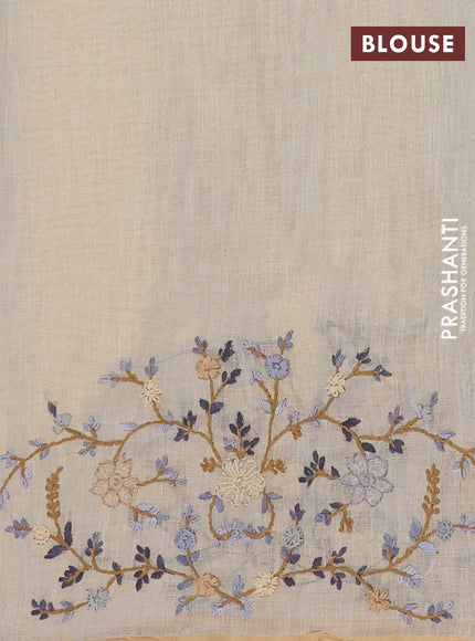 Linen cotton saree beige with embroidery buttas and zari woven border
