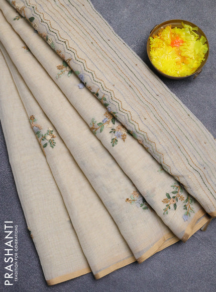 Linen cotton saree beige with embroidery buttas and zari woven border